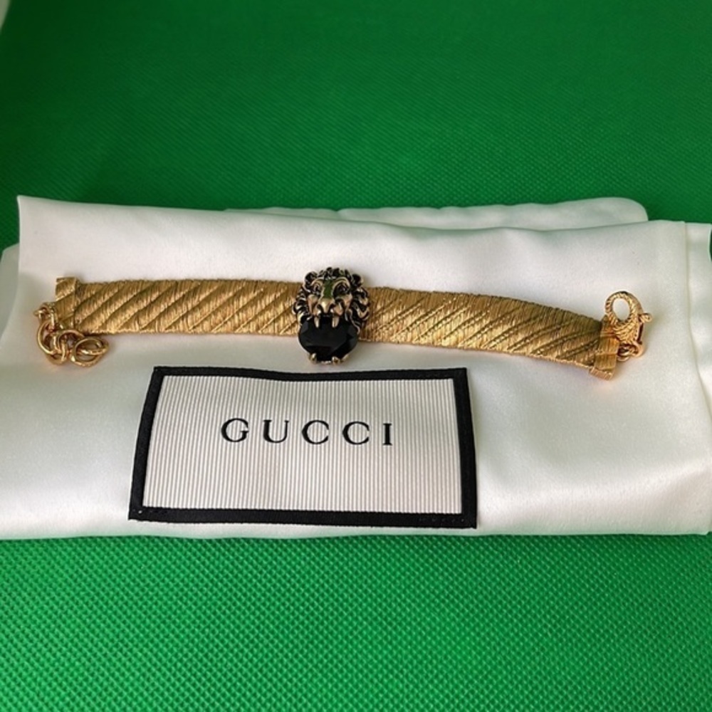 Gucci Gold Lion Head Bracelet with Black Accent